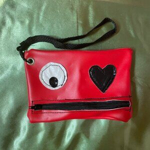 Red faux leather "monster" clutch NWOT
